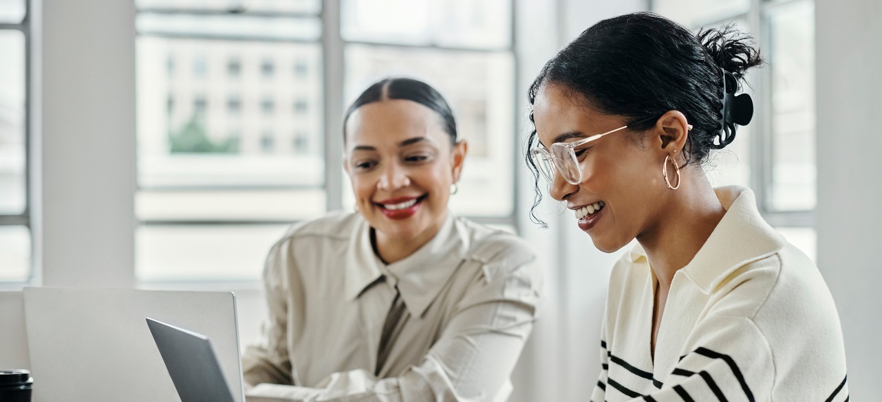 Business Women, Laptop And And Happy Team In Office For Web Design, Collaboration And Training. Planning, Digital Marketing And Coaching By Woman Leader Menor Help, Explain And Support Creative Goal