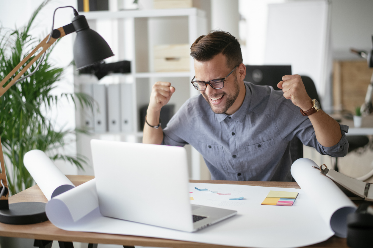 Happy Businessman Working In The Office.